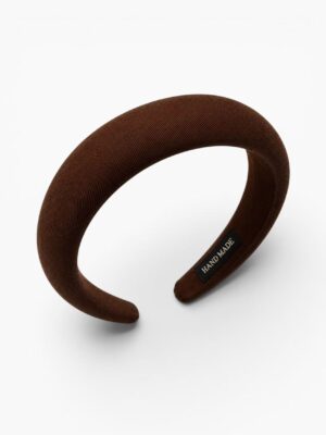 Elevate your everyday style with this elegant cocoa brown padded headband inspired by timeless French fashion. Featuring a softly structured wide silhouette with a rich chocolate brown tone, this headband instantly creates a polished and sophisticated look while remaining effortlessly wearable. Designed for both comfort and style, the padded shape helps create a fuller high crown effect while staying lightweight enough for comfortable all day wear. Perfect for casual outings, café styling, autumn inspired looks, or adding a refined vintage touch to your everyday wardrobe. ________________________________________ ✨ Why You’ll Love It • Elegant wide padded silhouette with a chic Parisian inspired aesthetic • Rich cocoa brown tone for a timeless and sophisticated look • Comfortable lightweight fit for everyday wear • Creates a fuller and more elevated hairstyle effect • Easy to pair with both neutral and earthy toned outfits ________________________________________ ✨ Product Details • Material: Fabric wrapped padded headband • Colour: Cocoa Brown • Style: Wide padded headband • Finish: Soft textured fabric • Suitable for: Everyday wear and effortless styling